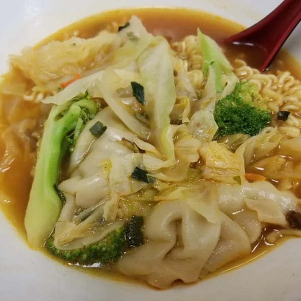Niko Teriyaki's ramen with wontons, broccoli, cabbage, and noodles in a savory broth.